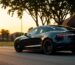 Stylish Tesla parked in a scenic neighborhood at sunset.