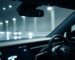 Close-up: sleek Tesla interior, glowing dashboard.